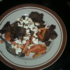 This is rendang (very spiced meat) and carrots topped with popcorn. I didn't have rice and I needed something to balance out the saltiness of the meat.